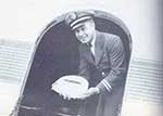 Captain Ernie Clark delivering a cake to celebrate SWA 1st Anniversary of scheduled passenger service in December 1947 